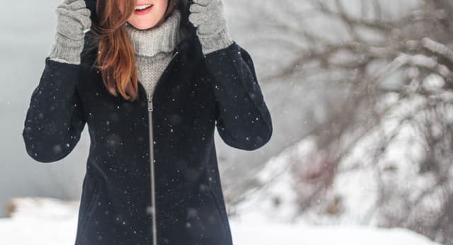 woman standing in the snow