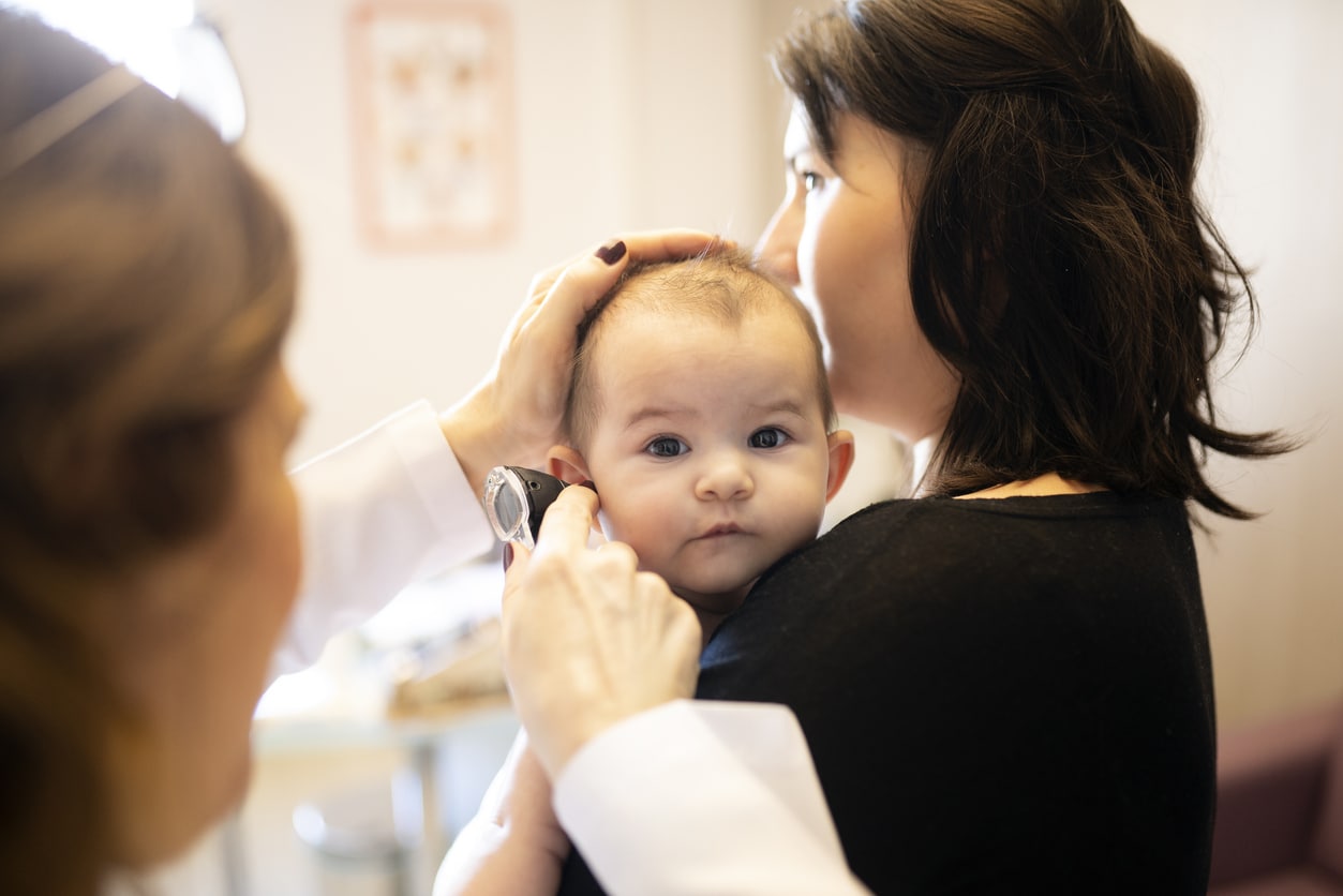 Infant getting a hearing exam.
