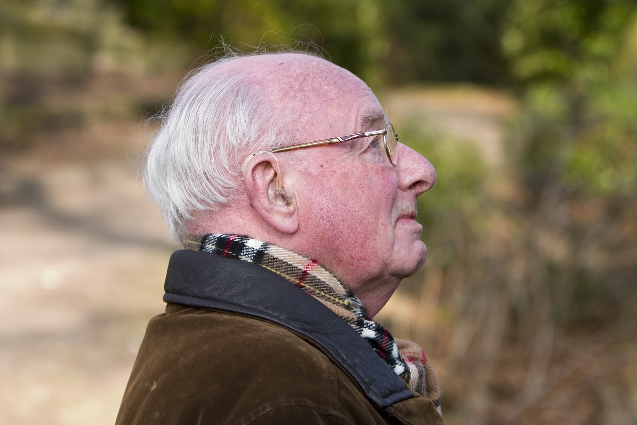 Man wearing hearing aids enjoying the colder winter weather.